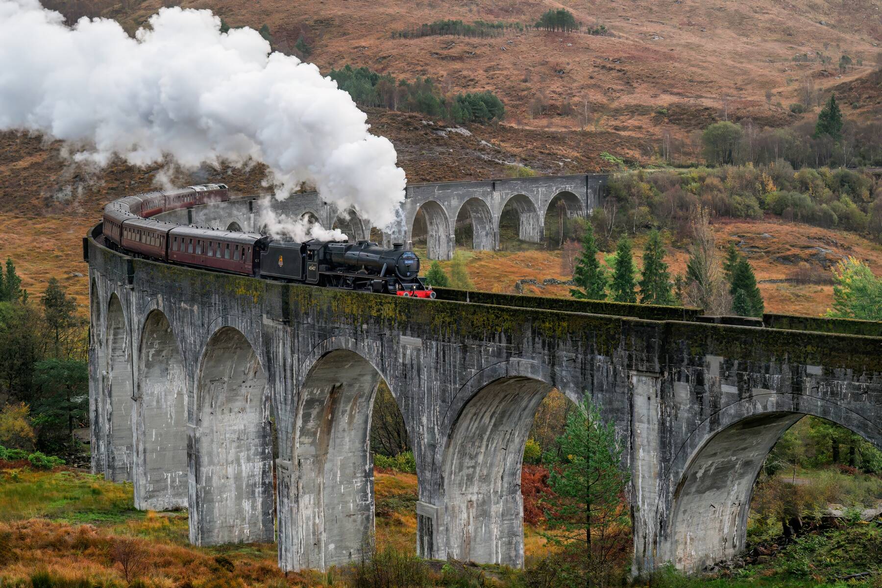 The Jacobite steam train crossing Glenfinnan Viaduct