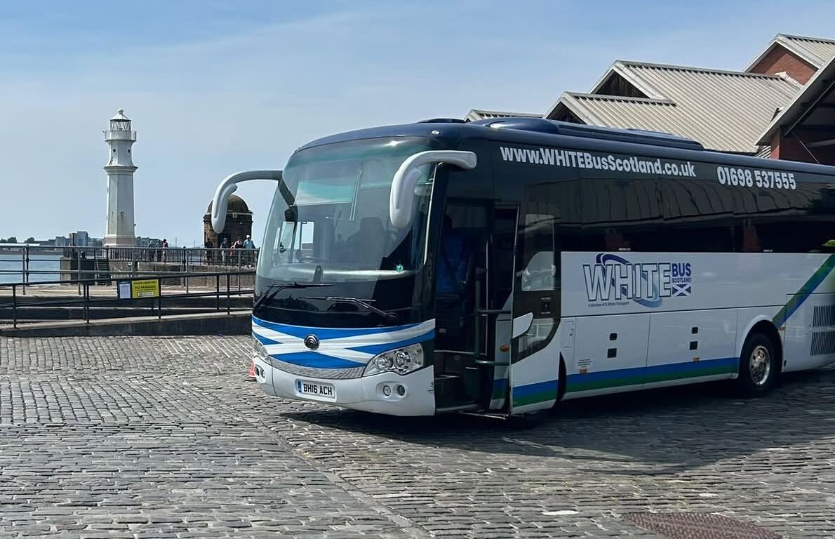 The White Bus Scotland touring coach on the harbour cobbles at Newhaven
